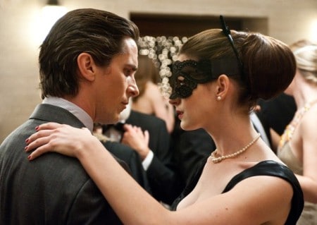 Bruce Wayne and Selina Kyle, dancing to a beat.