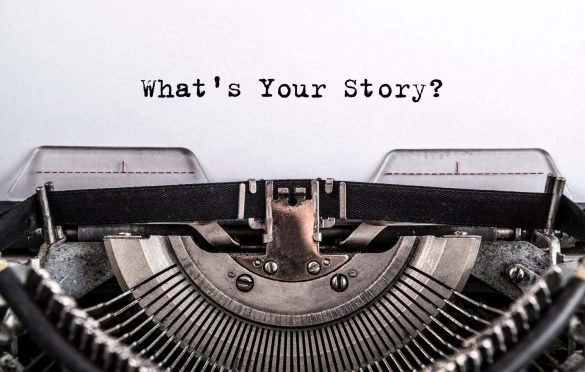 typewriter with 'what's your story?' text