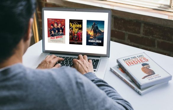 laptop screen with the posters for Knives Out, Jojo Rabbit, and The Mandalorian