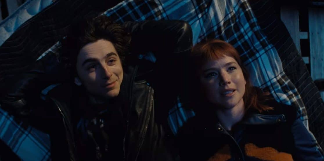 Timothee Chalamet and Jennifer Lawrence look up at the sky in Don't Look Up