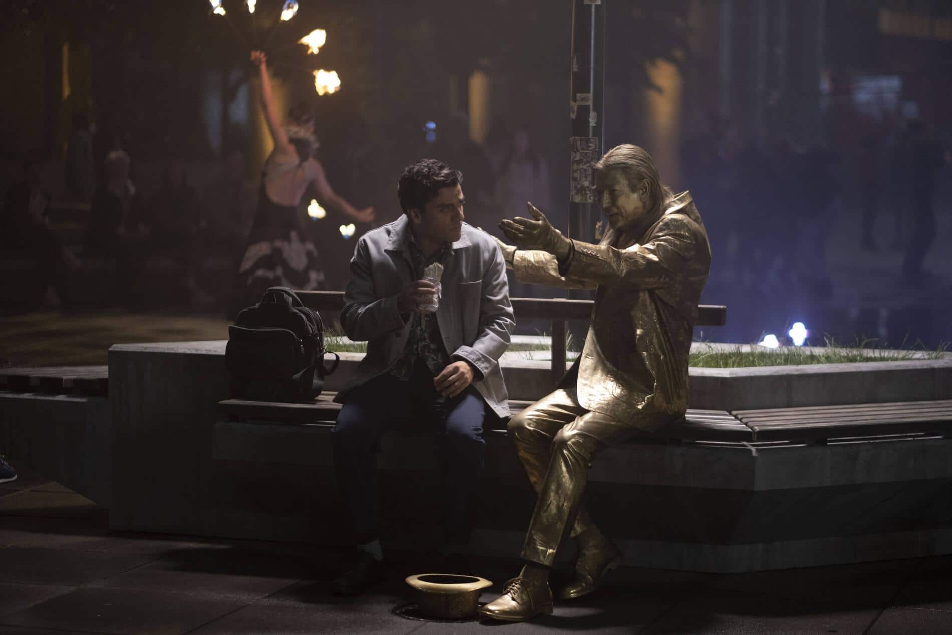 Oscar Isaac talks to a street performer in Moon Knight episode 1