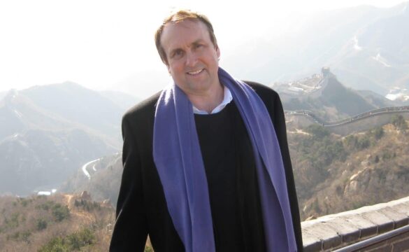 Blake Snyder in China with the Great Wall in the background