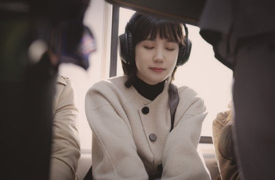 Eun-bin Pasrk wearing headphones listening to whale sounds in Extraordinary Attorney Woo