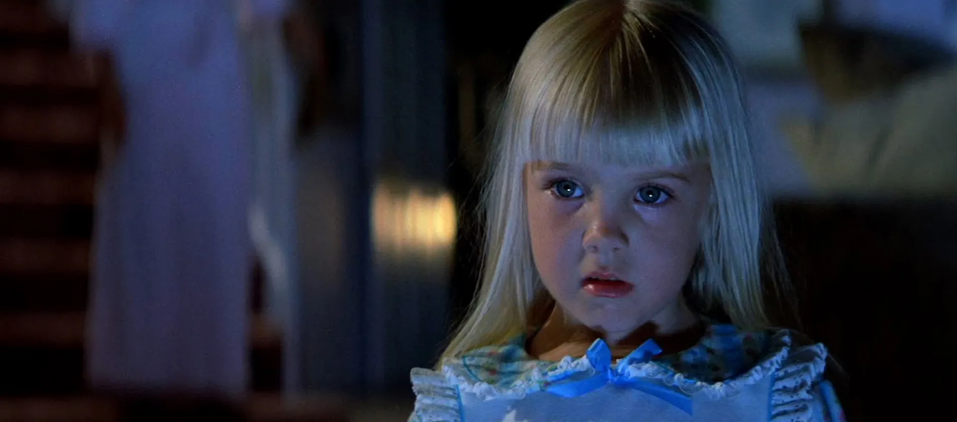 the little blonde girl in the light of the TV in Poltergeist