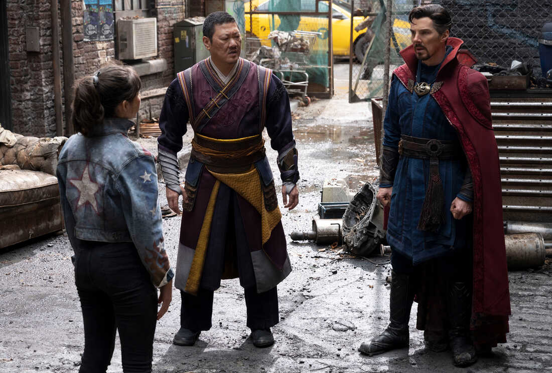 America, Wong, and Doctor Strange converse on a city street