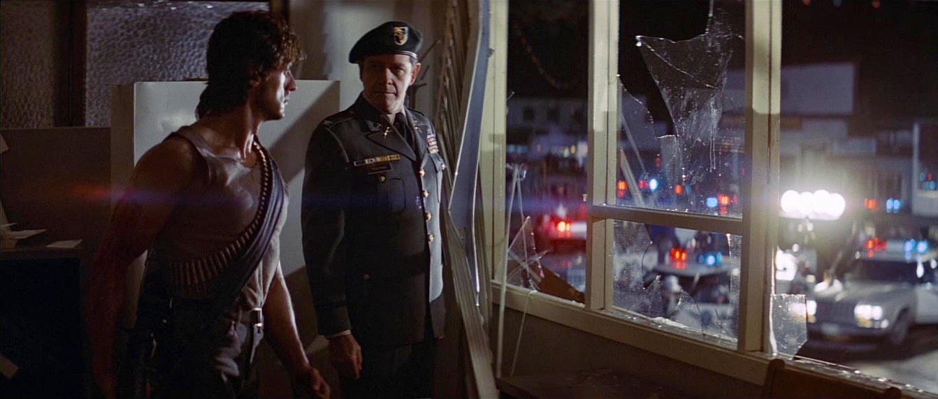 Rambo and Trautman inside a room with shattered windows