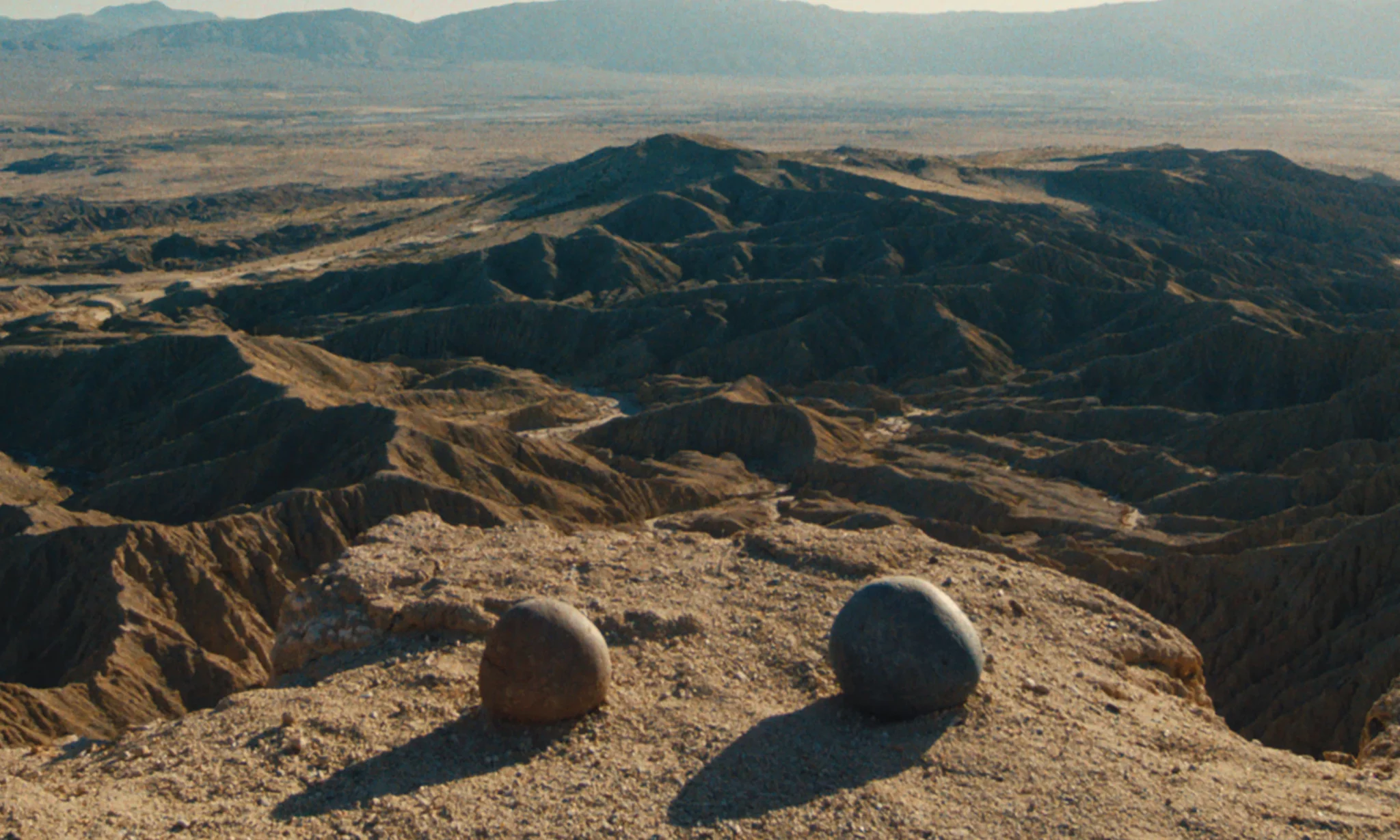 two round rocks overlooking a desert 