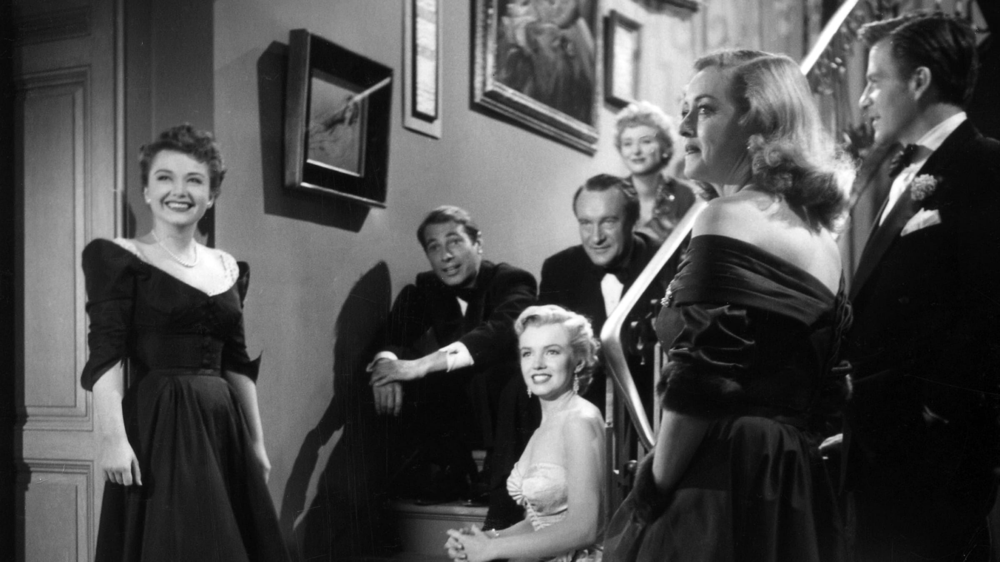 The cast of All About Eve on the staircase at Margo Channing;s apartment