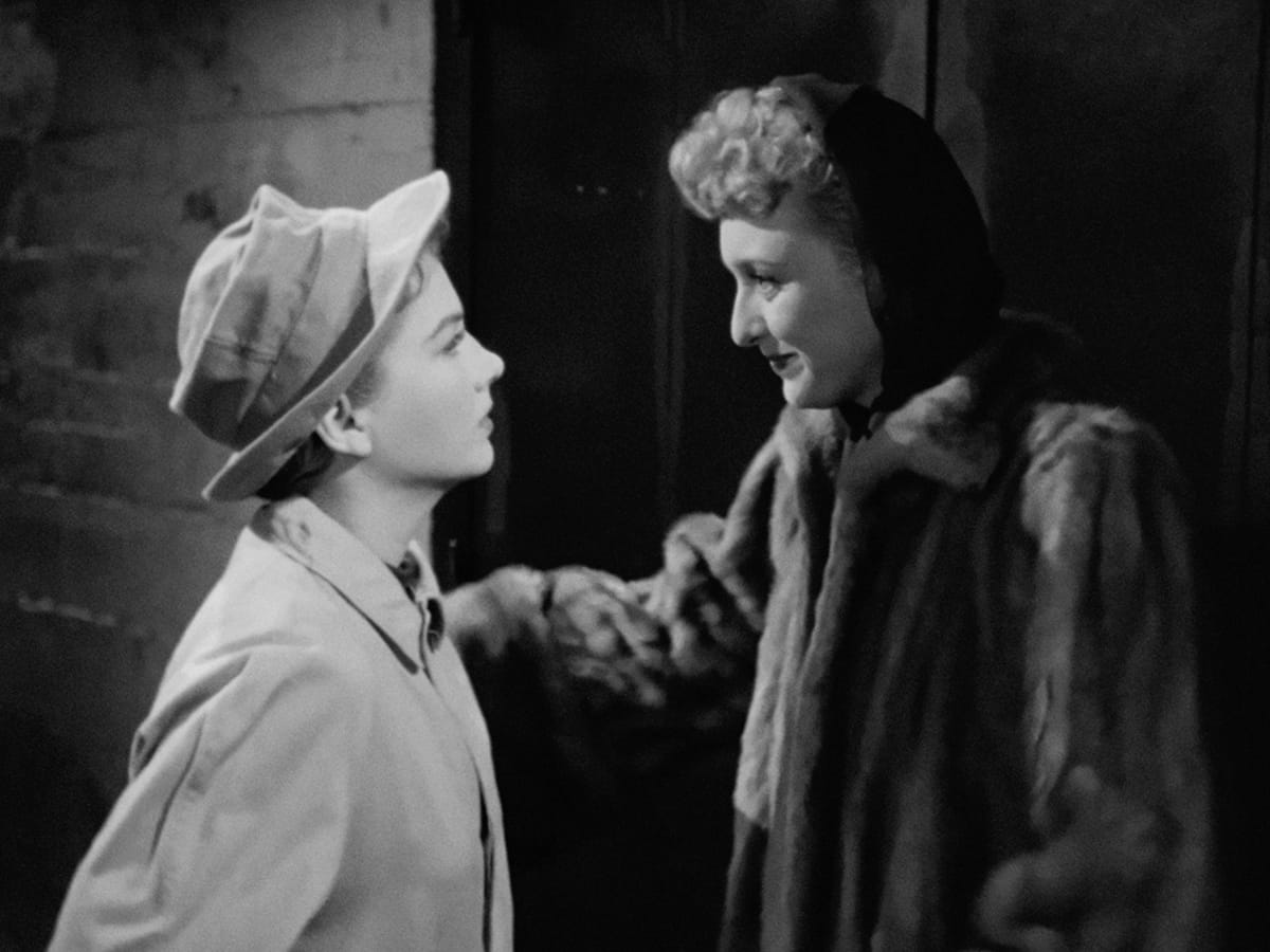 Anne Baxter faces Celeste Holm in All About Eve