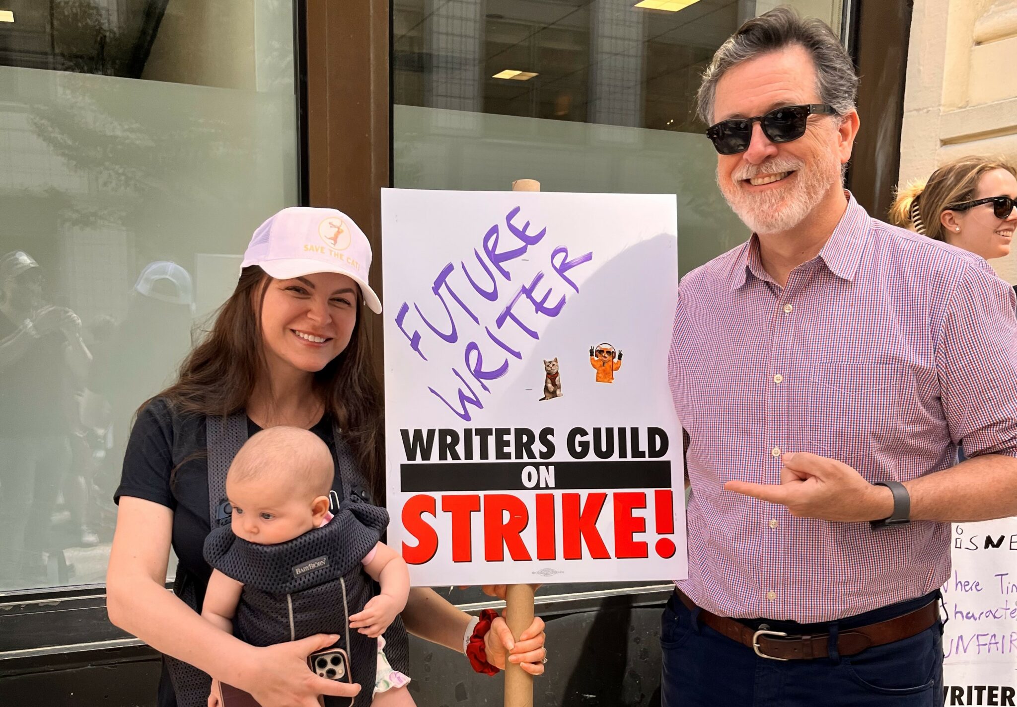 Anna and baby Kolinsky on the WGA picket line with Stephen Colbert