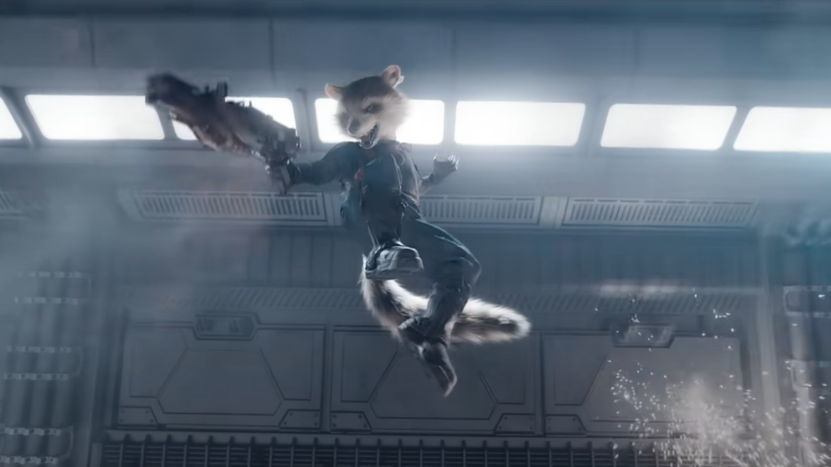 Rocket Raccoon flies through the air holding a large gun