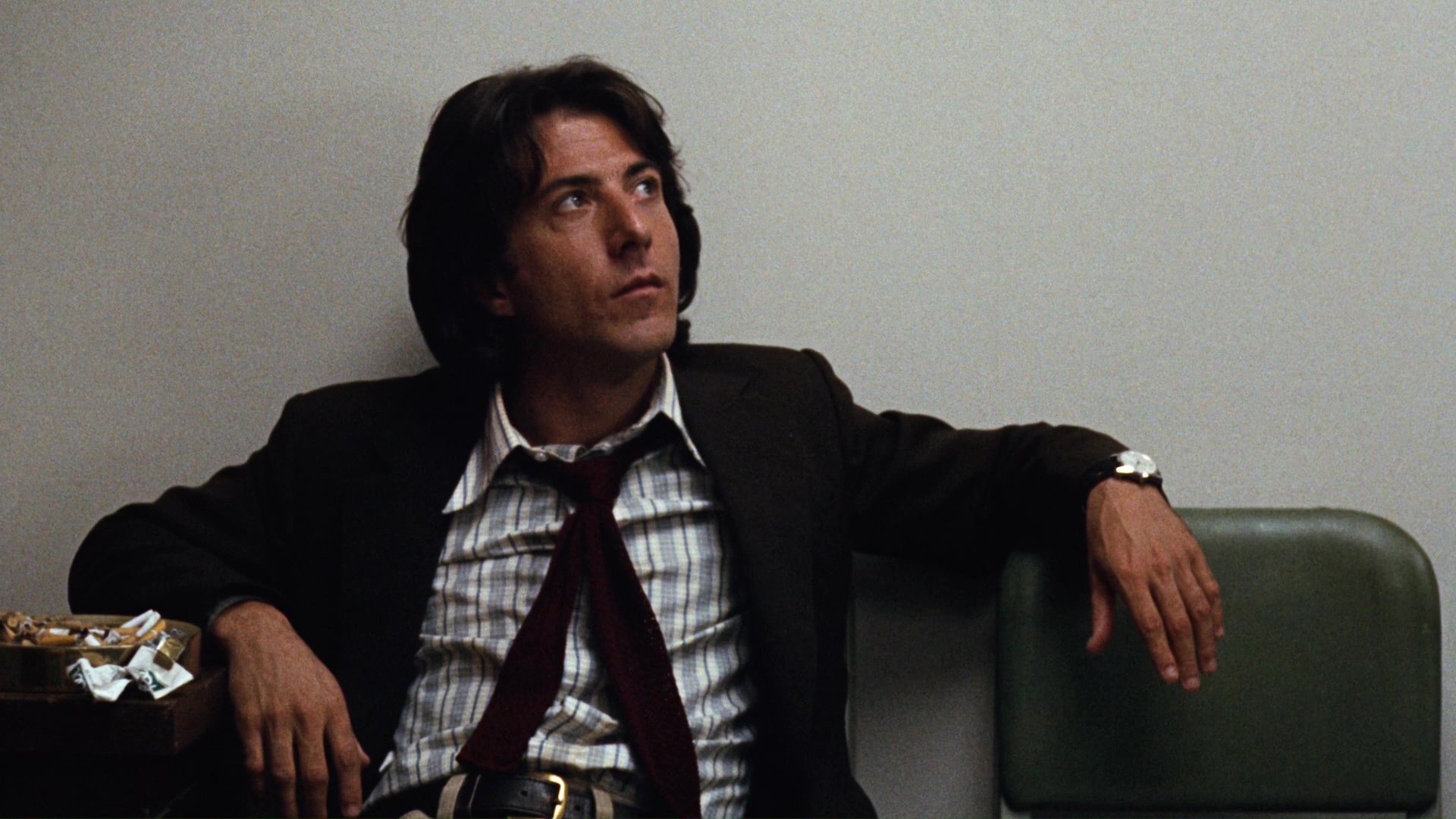 Dustin Hoffman with a full ashtray in All the President's Men