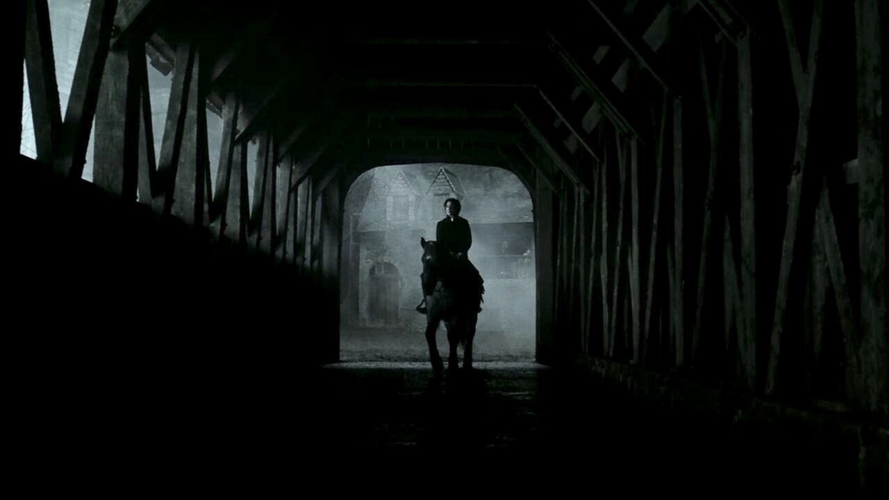 Ichabod Crane rides his horse in the stables of Sleepy Hallow