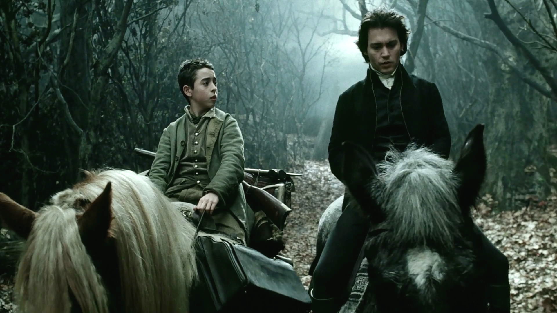 Young Masbeth and Ichabod Crane riding their horses
