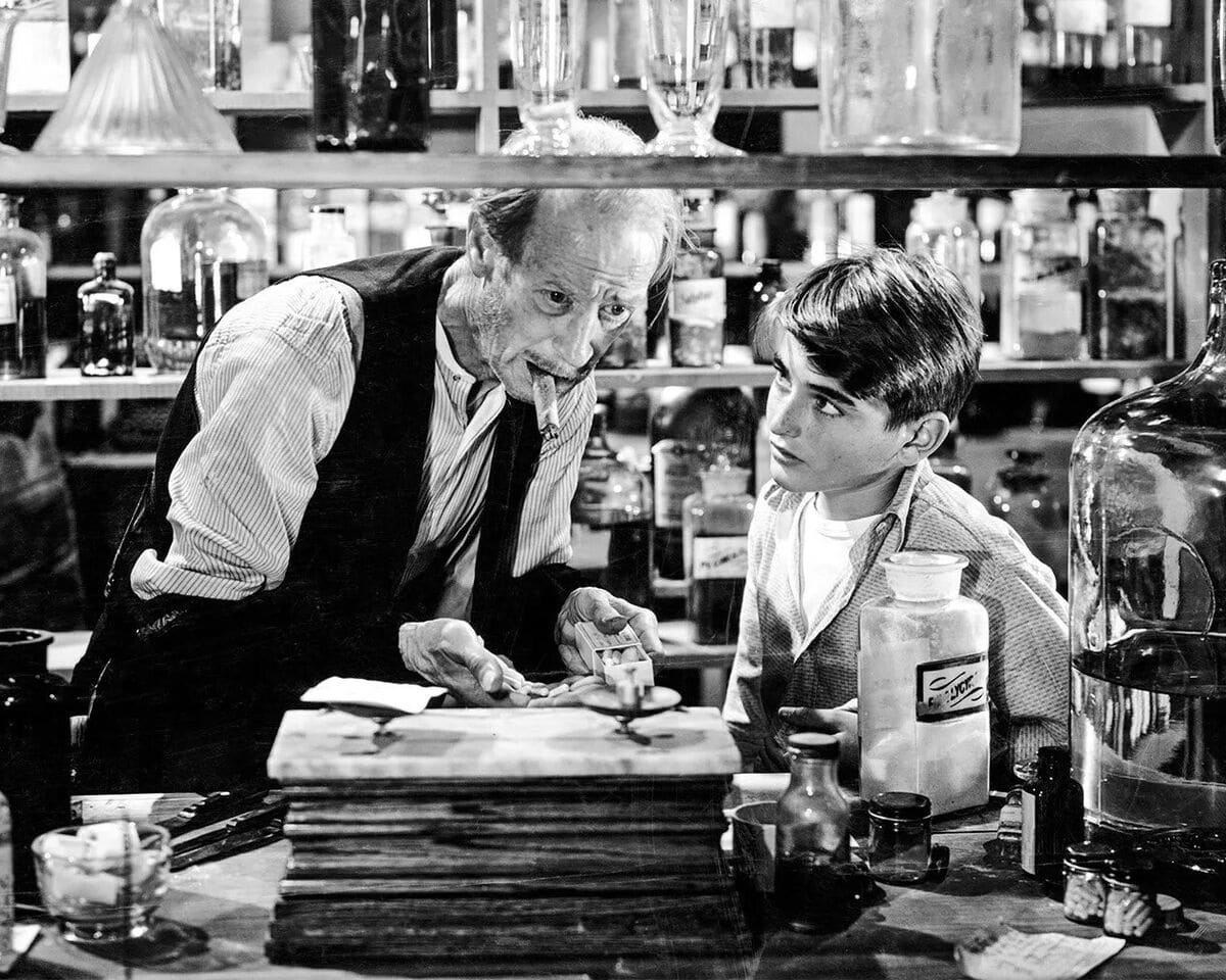 Mr. Gower and young George Bailey in Mr. Gower's pharmacy