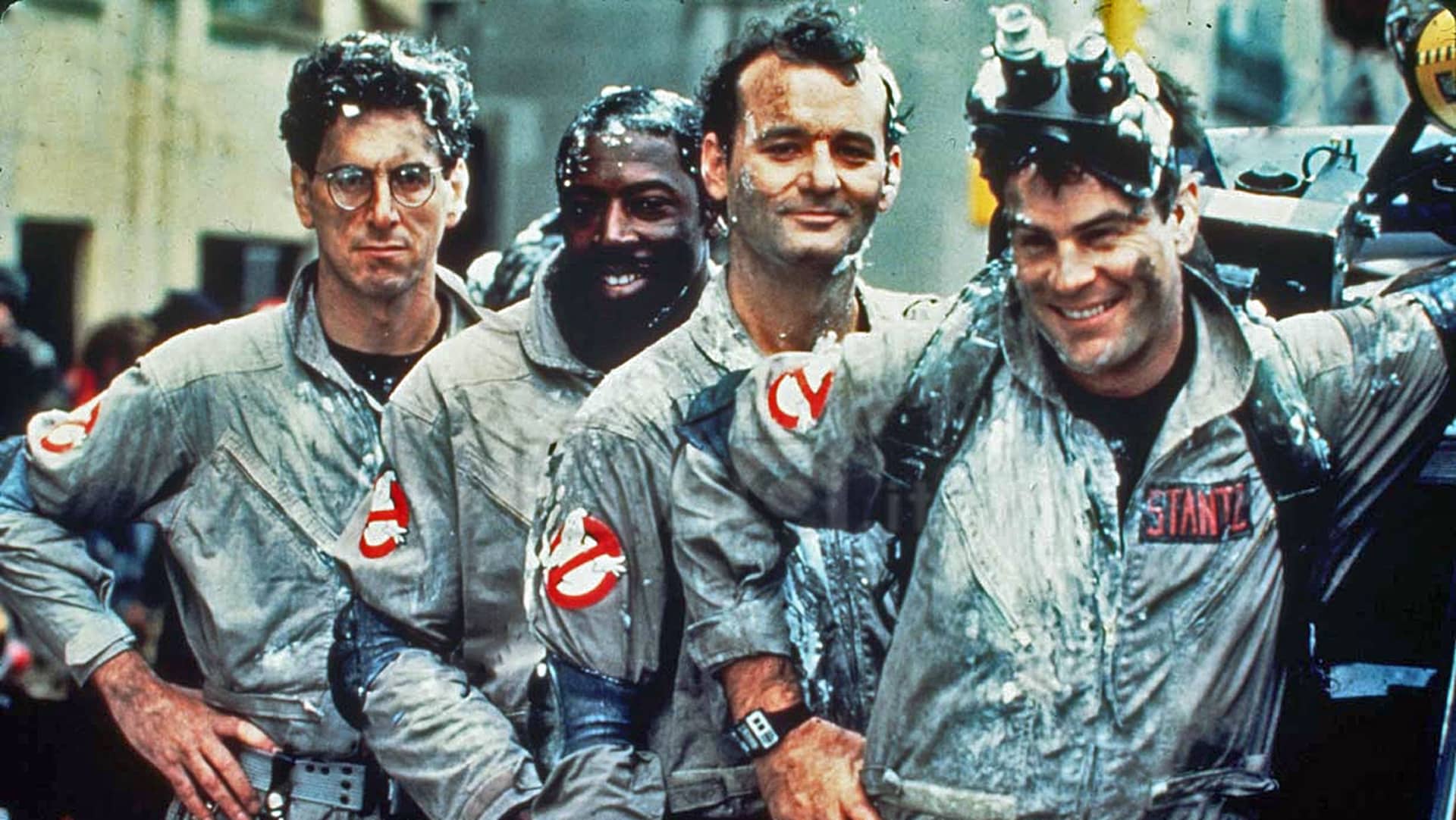 the 4 ghostbusters covered with marshmellow dust