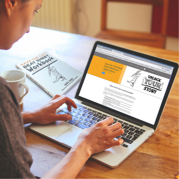 hands on a laptop keyboard with Save the Cat Beat Sheet Workbook Digital Edition on laptop screen