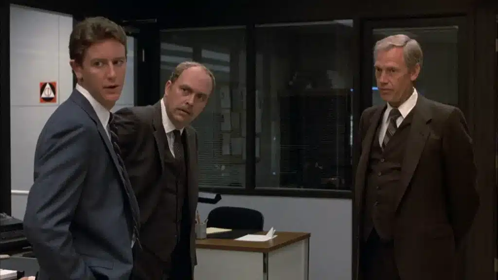 Rosewood, Taggart, and Bogomil standing in the police station