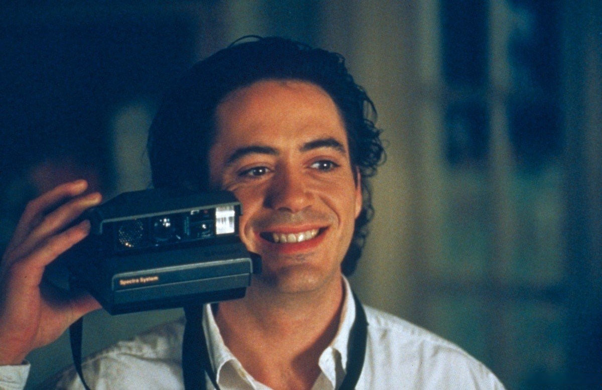 Tommy holding his Polaroid camera