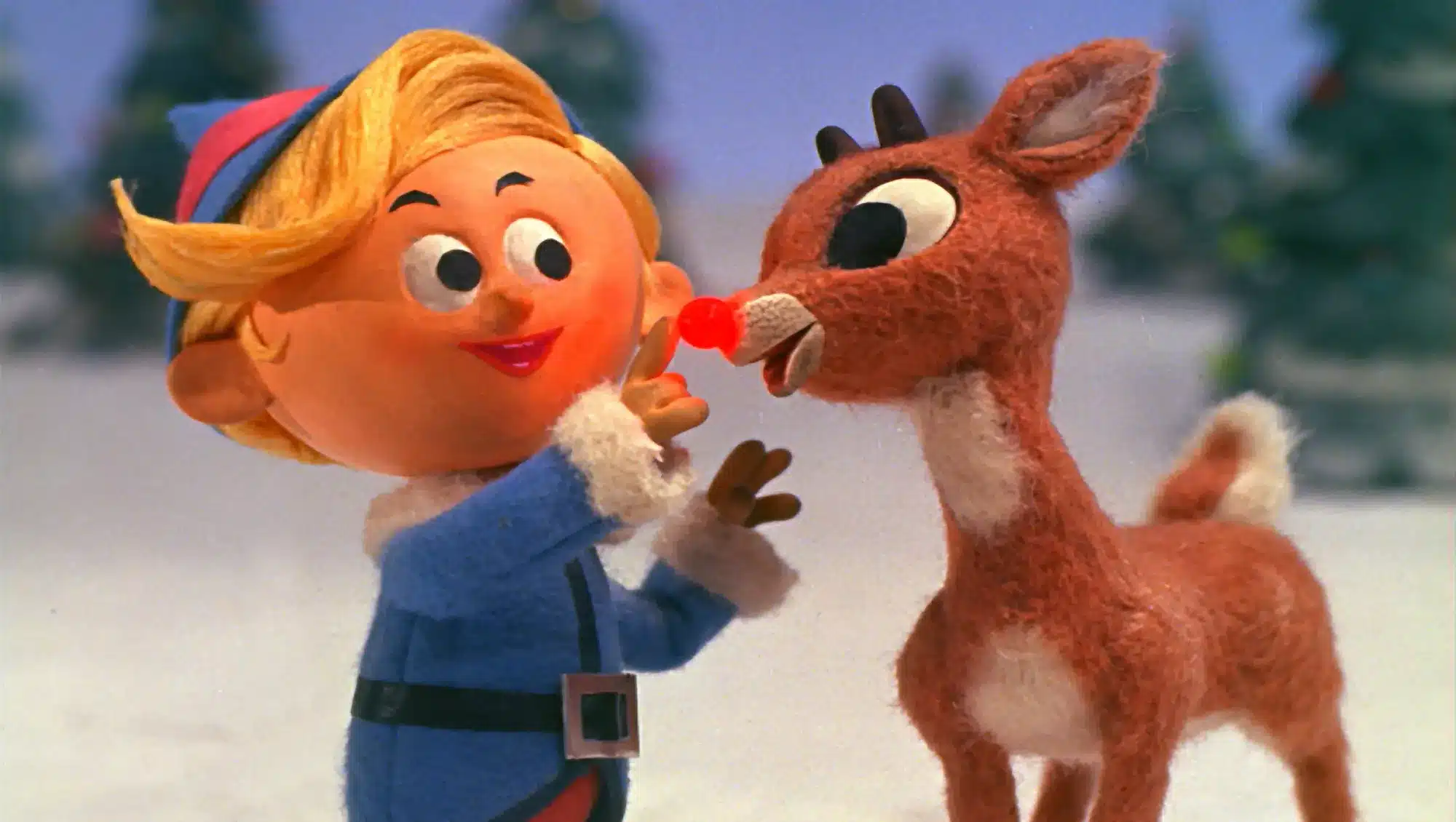 Hermey touches the nose of Rudolph the Red-Nosed Reindeer