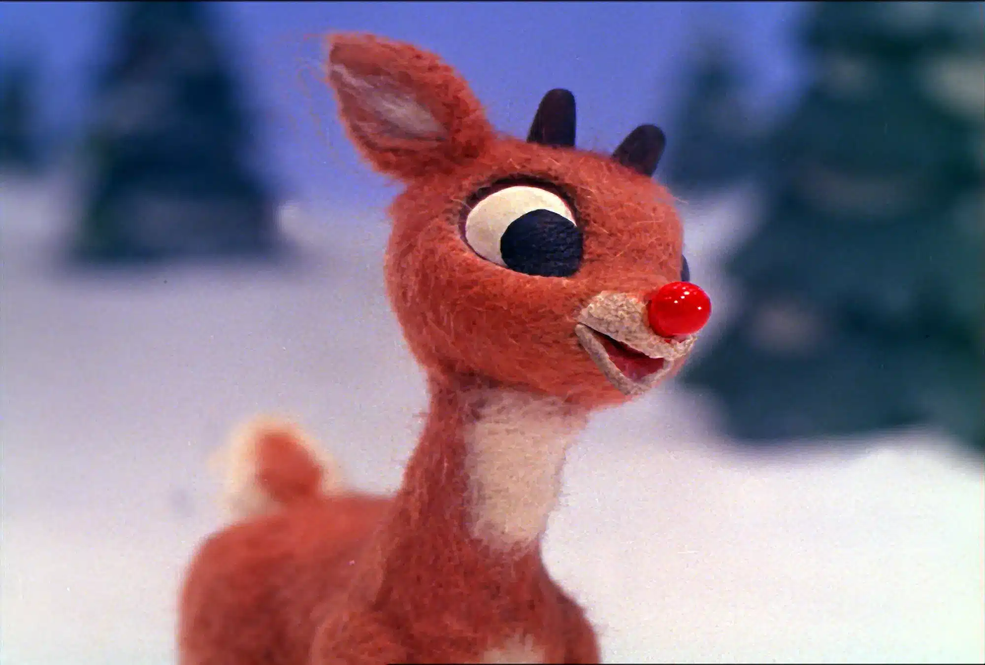 A smiling Rudolph the red-nosedReindeer