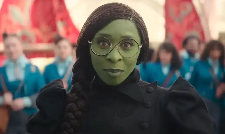Elphaba wearing her glasses in the Shiz University courtyard