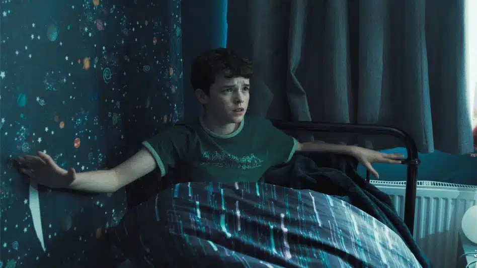 Jamie (Owen Cooper) sitting up in bed