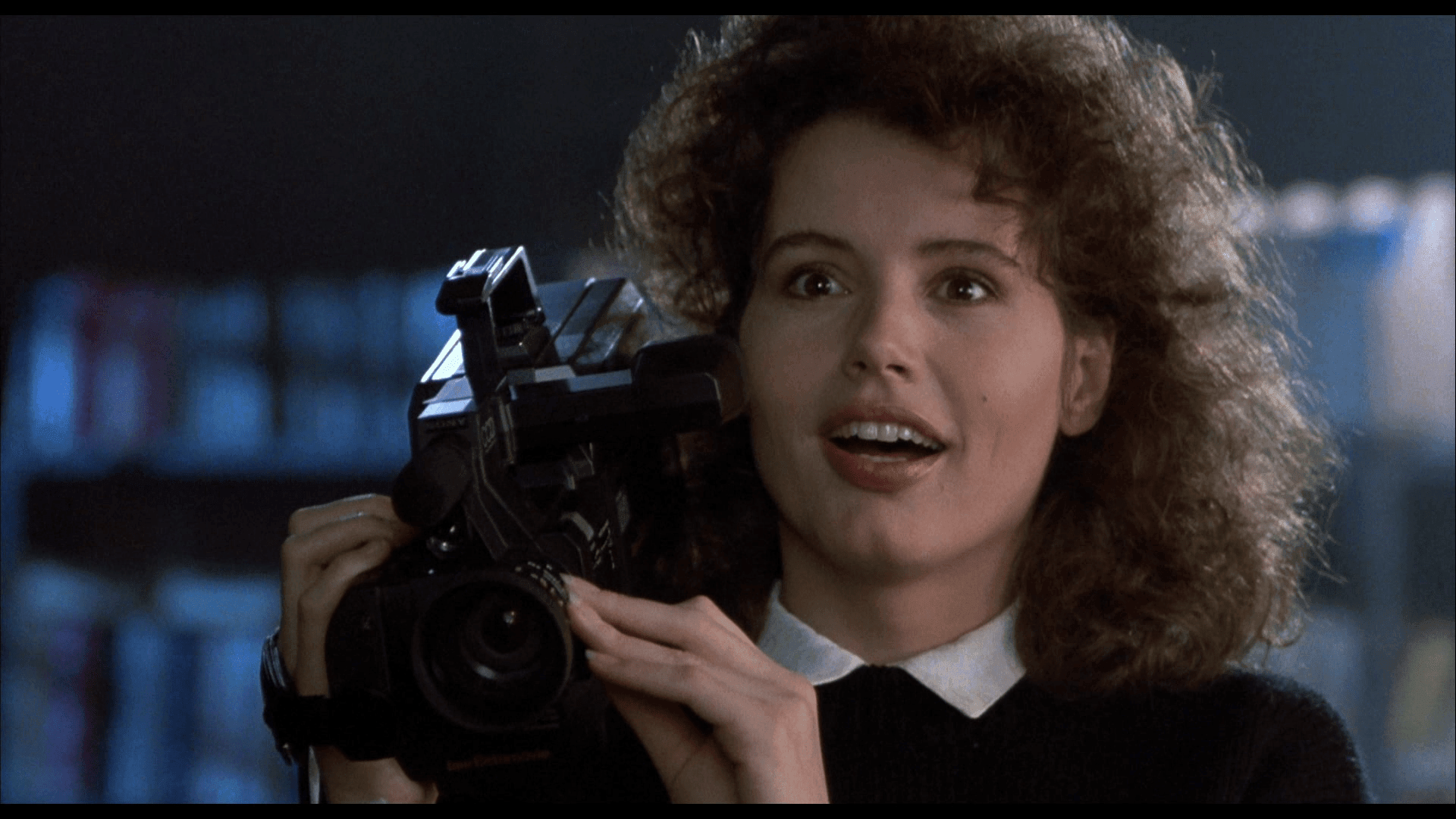 Geena Davis with a film camera on her shoulder