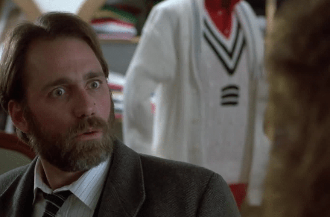 John Getz staring at Geena Davis in a clothing store