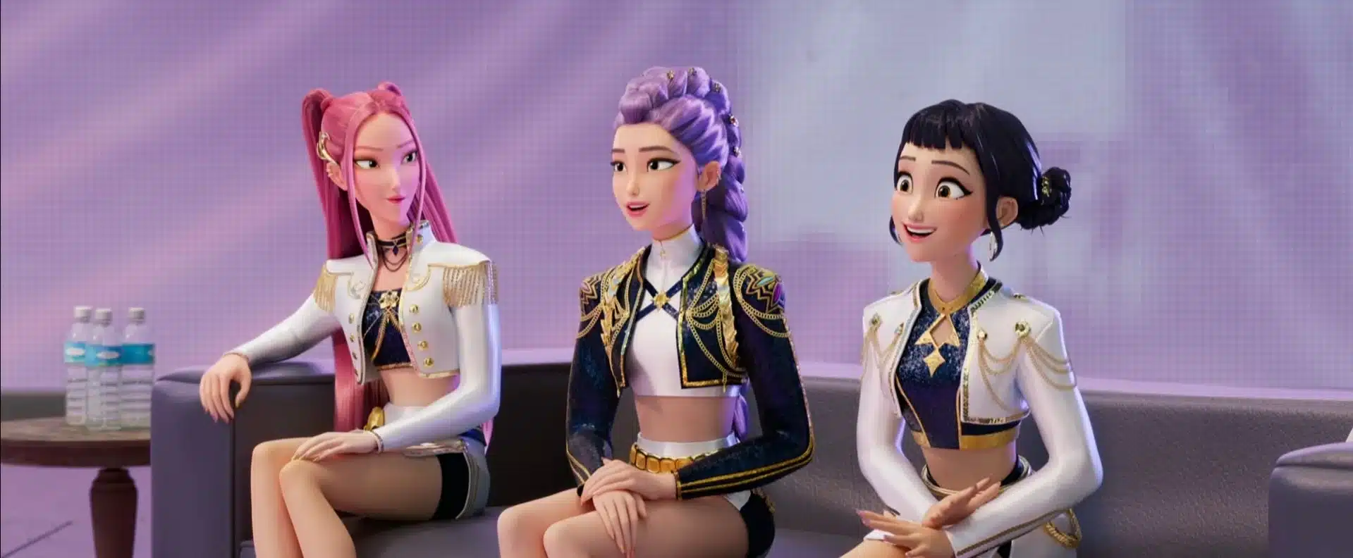 the 3 members of Huntix sit on a couch in an office
