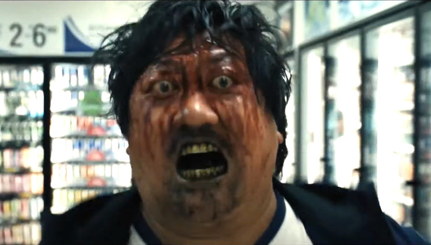 School principle Marcus with eyes bulging and blood streaming down his face in Weapons