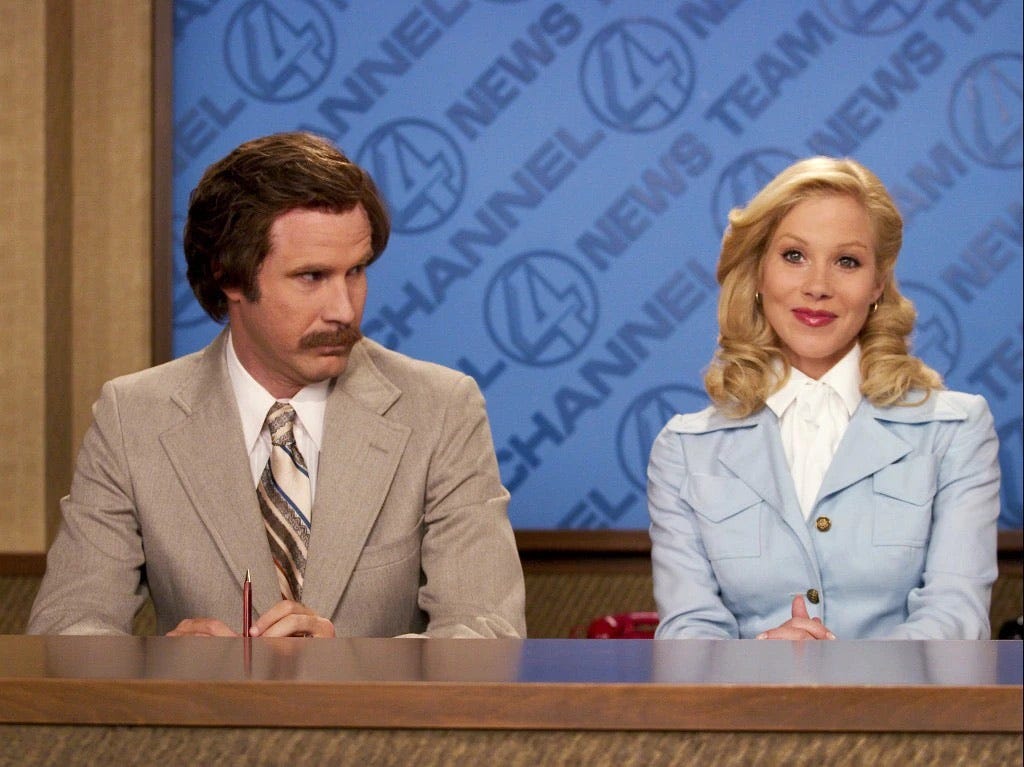 Ron and Veronica behind the anchor desk together