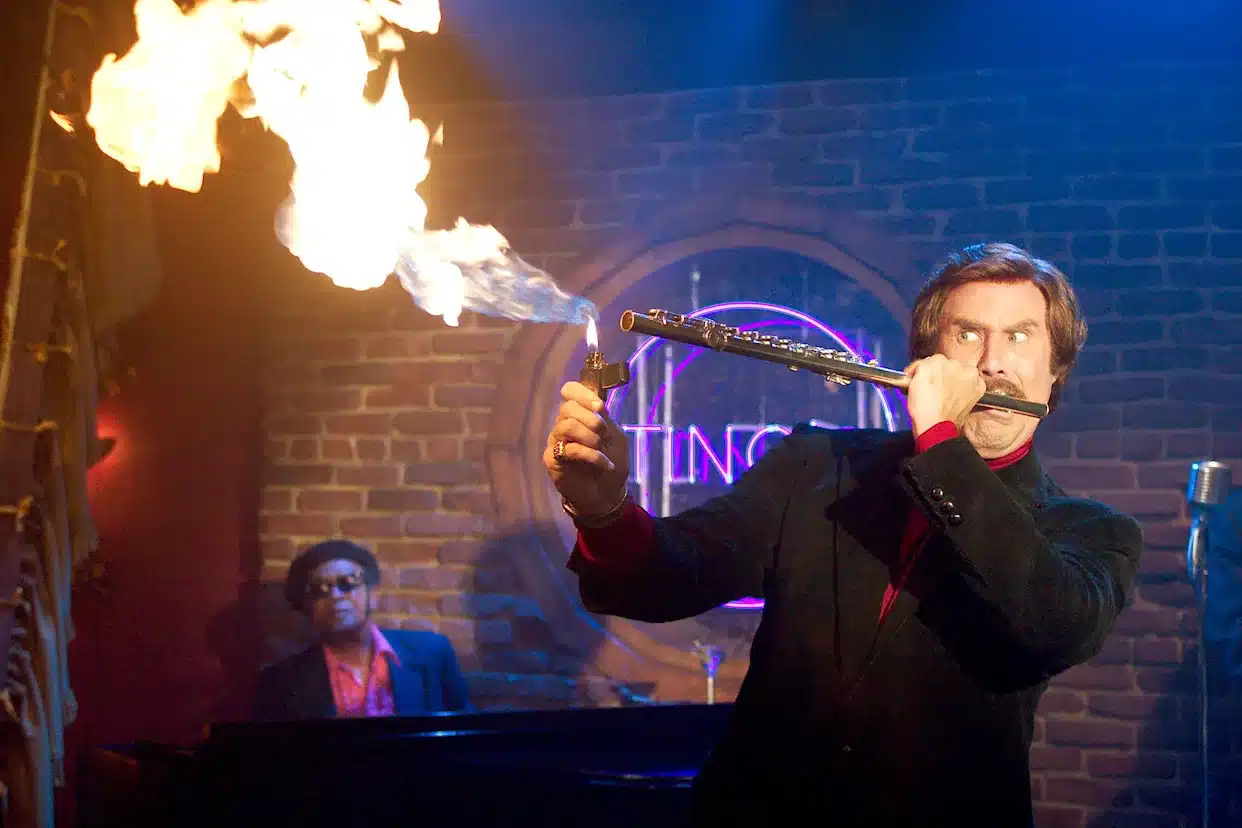 Ron Burgundy plays a flute that's on fire in a jazz nightclub