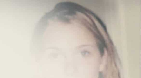 faded image of Virginia Giuffre from the cover of 'Nobody's Girl'