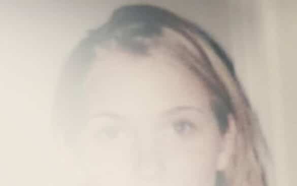 faded image of Virginia Giuffre from the cover of 'Nobody's Girl'