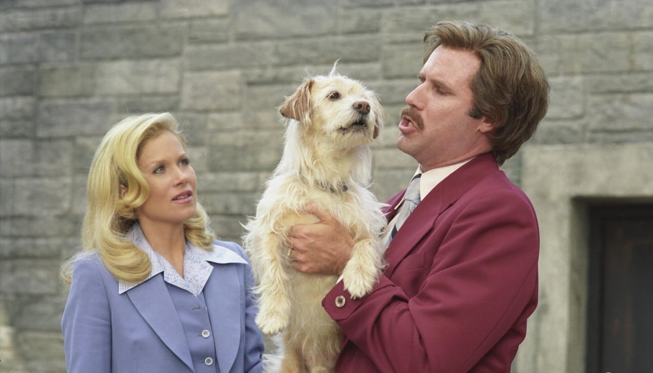 Veronica and Ron, who is holding Baxter the dog