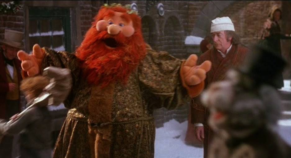 Muppets surround Scrooge, celebrating Christmas on the street
