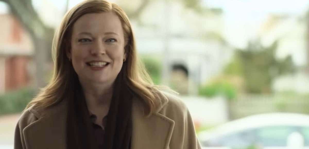 Sarah Snook at the doorway of a house