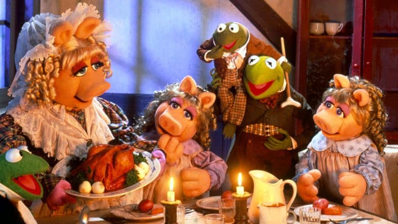 The Muppets as the Cratchit Family, celebrating at a dinner table