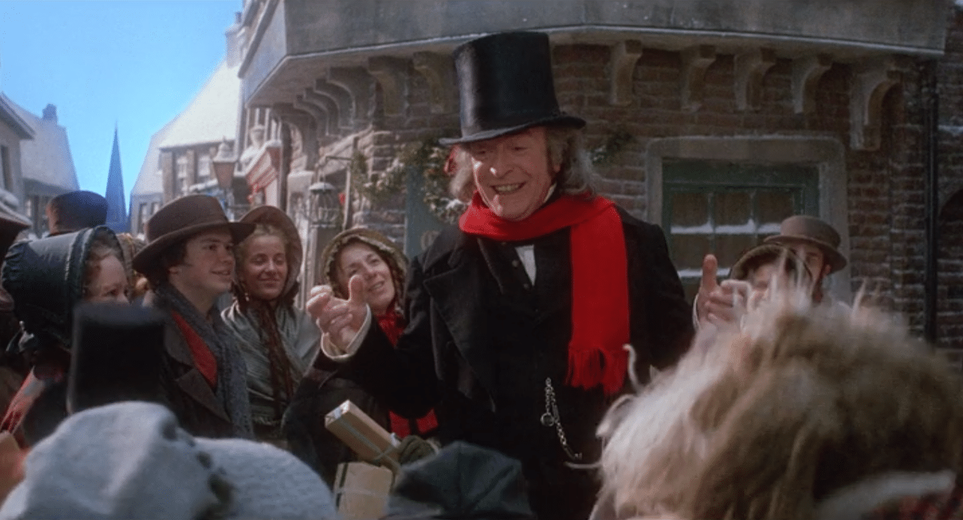 Michael Caine celebrating with a bunch of Muppets on a Victorian street