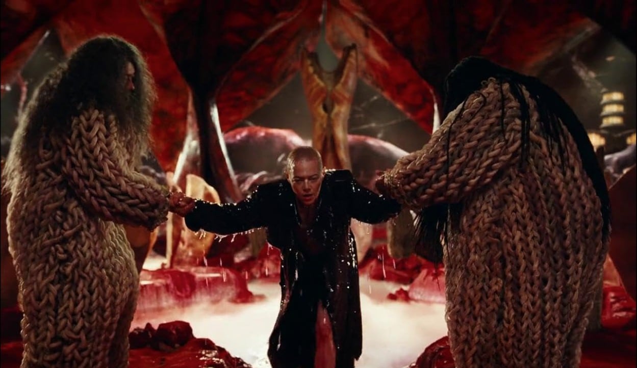 Michelle, the Emporer, is lifted out of the water by 2 asswociates