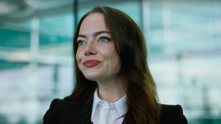 Emma Stone as CEO Michelle Fuller in her modern office