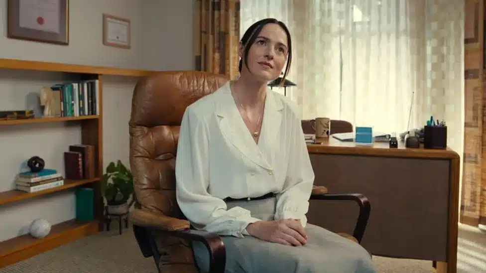 Mary in her leather chair in her office