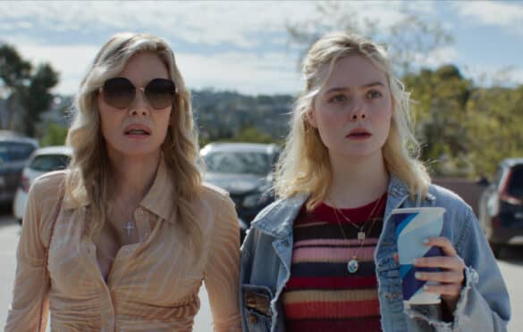 Michelle Pfeiffer and Ellen Fanning standing side by side in a parking lot