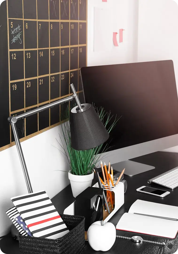 Desk with computer and writing utensils