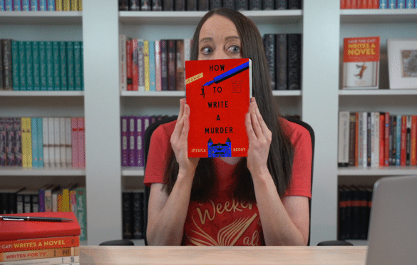 Jessica Brody peeking out from behind a copy of her novel, How to Write a Murder
