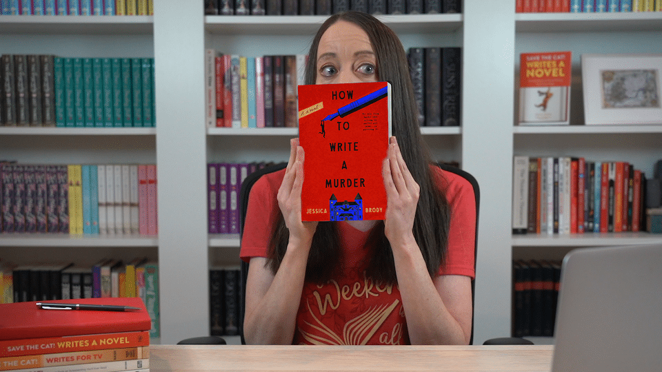 Jessica Brody peeking out from behind a copy of her novel, How to Write a Murder