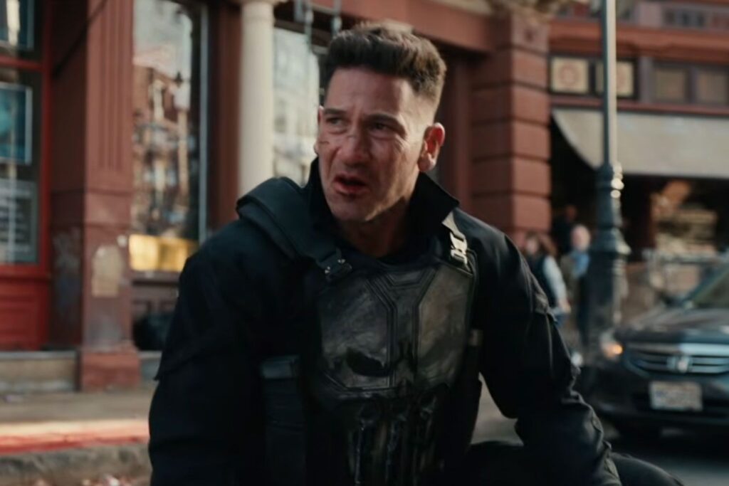 The Punisher stands on a city street