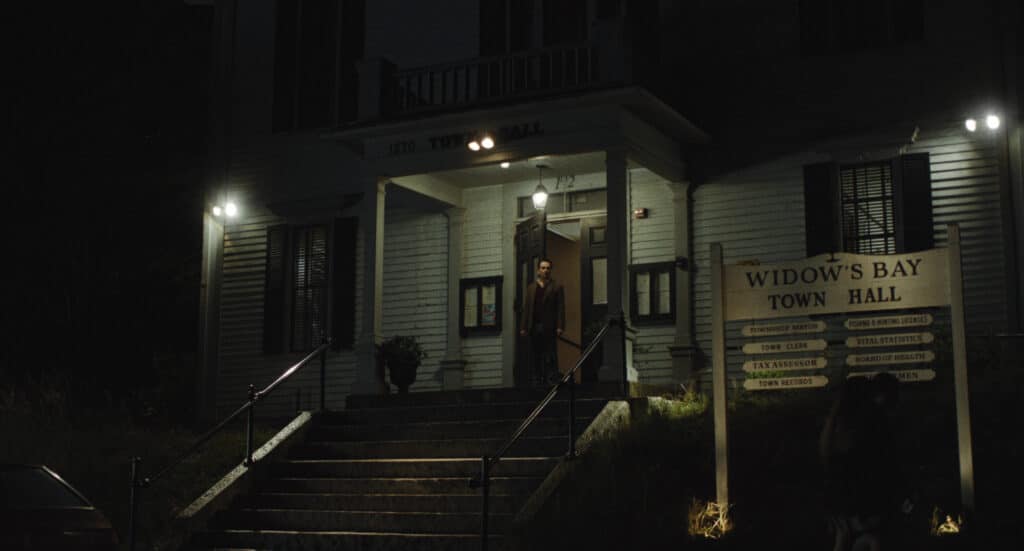 Mayor Tom Loftis stands on the steps of Widow's Bay Town Hall in the nigh