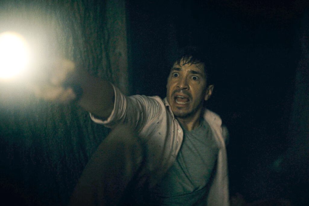 A frightened Justin Long points